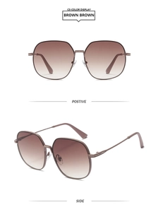 Detail of square vintage sunglasses with brown gradient lenses and bronze alloy frame