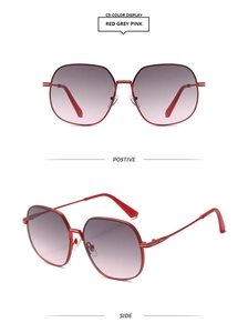 Macro detail of red metal frame sunglasses with gradient grey-pink lenses and glitter edge