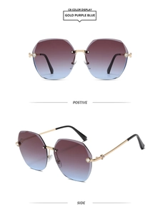 Detail view of rimless gold sunglasses with gradient purple blue lenses and metal decor