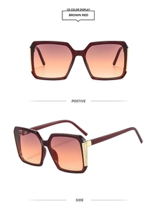 Detail of square oversized brown red sunglasses with gold hollow metal decoration