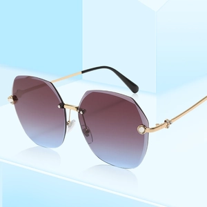 Frameless geometric rhinestone sunglasses with blue-purple gradient lenses and gold metal frame