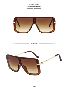 Detalle de gafas de sol cuadradas con patillas de metal dorado y bisagra con diseño de nudo