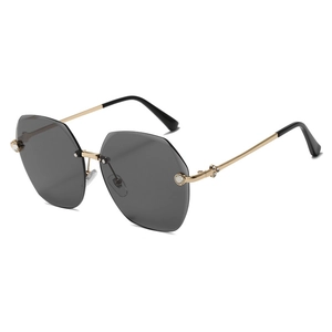 Chic rimless polygon sunglasses with gold metal temples and rhinestone accents