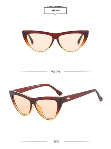 Detail view of brown cat eye sunglasses with metallic hinge accents and gradient lenses