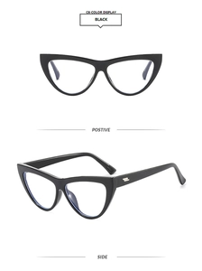 Detail view of black cat eye glasses frames with elegant metal hinge accents on white background
