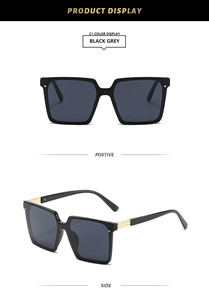 Front and side view of square oversized black sunglasses with gold metal temple accents