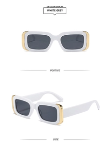 Detail view of white square sunglasses with grey lenses and gold metal temple accents
