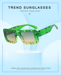Detail of neon green hollowed-out square sunglasses frame with UV400 gradient lenses