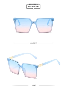 Detail view of square blue frames with gradient blue-pink lenses and gold metal accents