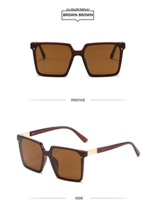 Detail view of square brown sunglasses showing golden metal hinges and side temples