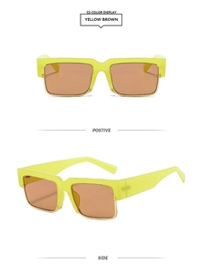 Close-up of yellow square sunglasses with gold metal trim and brown tinted lenses