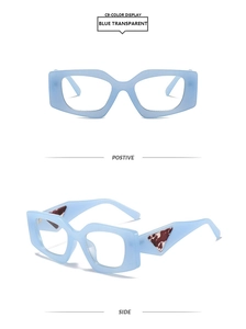 Detail of square light blue transparent sunglasses with triangle marble temple decor