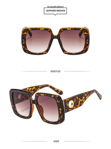 Detail view of leopard brown square sunglasses with gold metal ring on wide temples