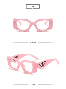 Detail of pink geometric sunglasses with thick frames and marble triangle temple decor