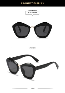 Front and side views of black cat-eye sunglasses with gold metal bridge and grey lenses