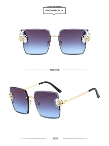 Détail de lunettes de soleil carrées demi-cerclées avec charnière fleurie dorée