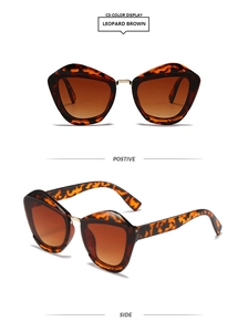 Detail view of leopard brown cat-eye sunglasses with gradient lenses and gold bridge