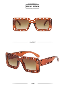 Detail view of brown square sunglasses with unique hollow frames and gradient lenses
