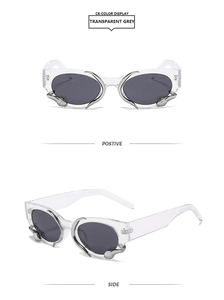 Detail of transparent grey square sunglasses with snake-like silver metal frame accents