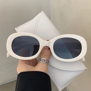 Retro oval sunglasses in off-white frames with dark lenses and matching leather pouch