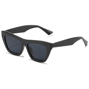 Fashionable oversized cat-eye sunglasses with thick black frame and dark grey lenses