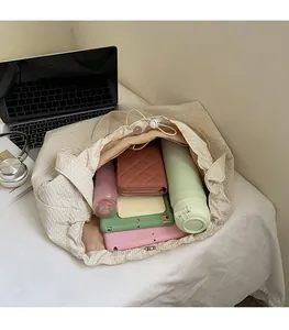 Spacious beige waffle-textured tote bag interior showing multi-compartment storage space