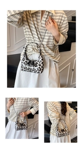 Detailed views of leopard print hobo bag with silver chain and glossy finish