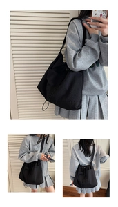 Detail view of the black wrinkled nylon tote bag showing drawstring closure and utility pockets