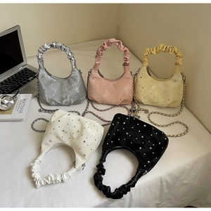 Detailed display of rhinestone ruched dumpling bags in silver, pink, yellow, white and black