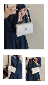 Detailed views of a white crocodile embossed rectangular crossbody bag with silver hardware