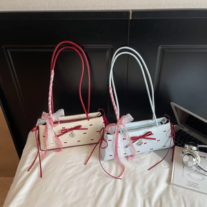 Japanese style underarm bags with red bow prints and heart charms in beige and blue