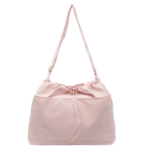 Pink drawstring tote bag with textured grid pattern and adjustable shoulder strap