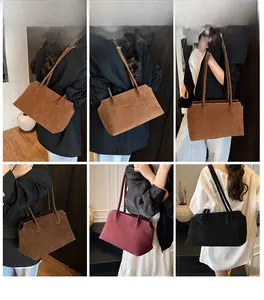 Three minimalist large suede tote bags in brown, burgundy, and black for daily commute