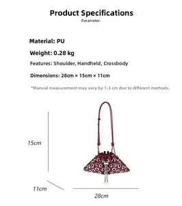 Detail view of burgundy PU leather bucket bag featuring silver eyelets and pearl tassels