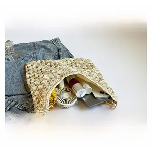 Internal view of large woven straw tote bag showing spacious capacity for summer items