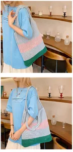 Detail of color-block knit tote bag showing the textured crochet mesh and spacious design