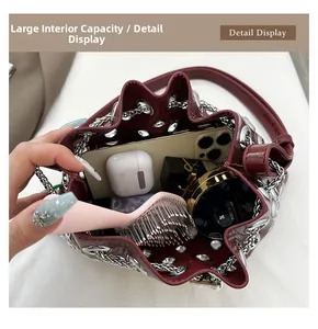 Internal view of burgundy leather bucket bag showing large capacity for essentials