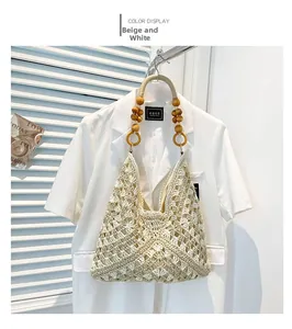 Detail of hand-woven beige shoulder bag with hollow crochet texture and wooden bead handles