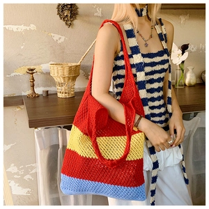 Detail of colorful striped crochet tote bag with mesh texture and bohemian style