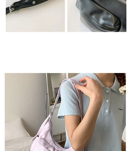 Detail view of light purple nylon crescent bag with side decorative zip and metal buckles
