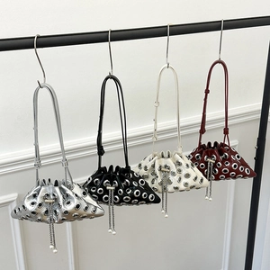 Chic punk bucket bags with metal grommets and chain fringe in four versatile colors