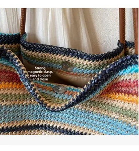Detail of woven rainbow tote bag featuring strong magnetic buckle closure and brown handles