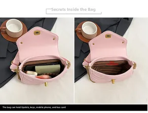 Detail view of pink quilted handbag interior showing a spacious main compartment