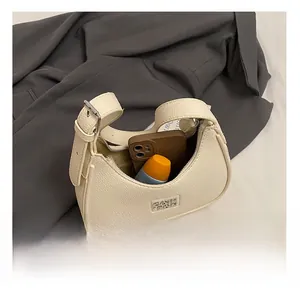 Interior view of off-white lychee texture leather underarm bag showing spacious storage