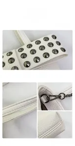 Detailed macro view of white pebble leather handbag with gray metal studs and chain