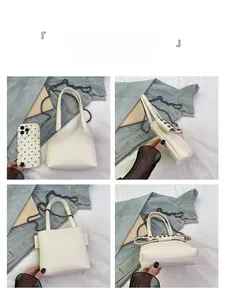 Macro detail of white pebble leather handbag with metal rivet bow and chain strap