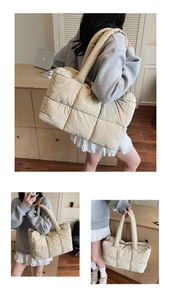 Macro detail of beige quilted nylon tote bag showing plush square stitching and soft textures