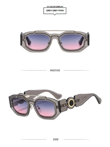 Detail view of square punk sunglasses with grey pink gradient lens and gold hinge hardware