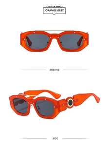 Detail view of orange square sunglasses with silver rivets and metal hollow temple design
