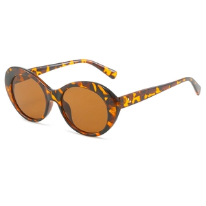 Retro tortoise shell oval sunglasses with amber lenses and gold rivet accents